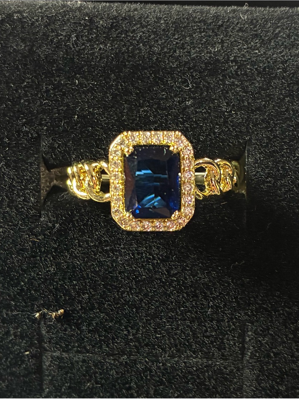 Gold-Tone Ring with Deep Blue Emerald-Cut Center and Pavé Frame